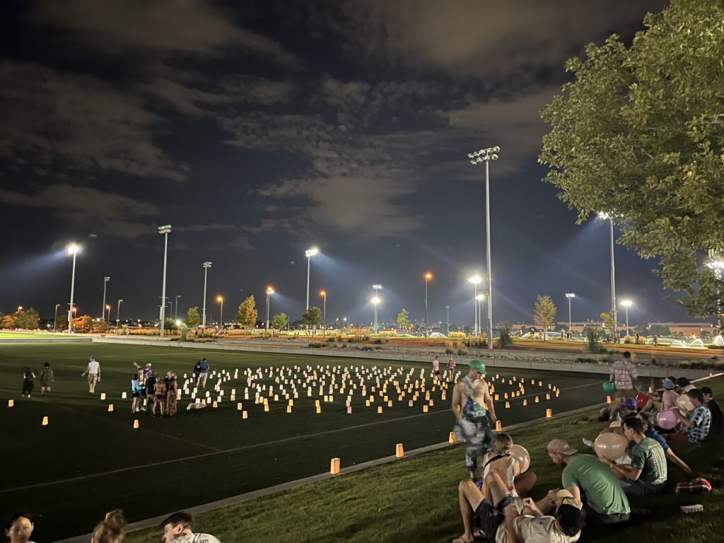 Fans gather around JBG’s luminary labyrinth honoring James Casey at Dick’s.