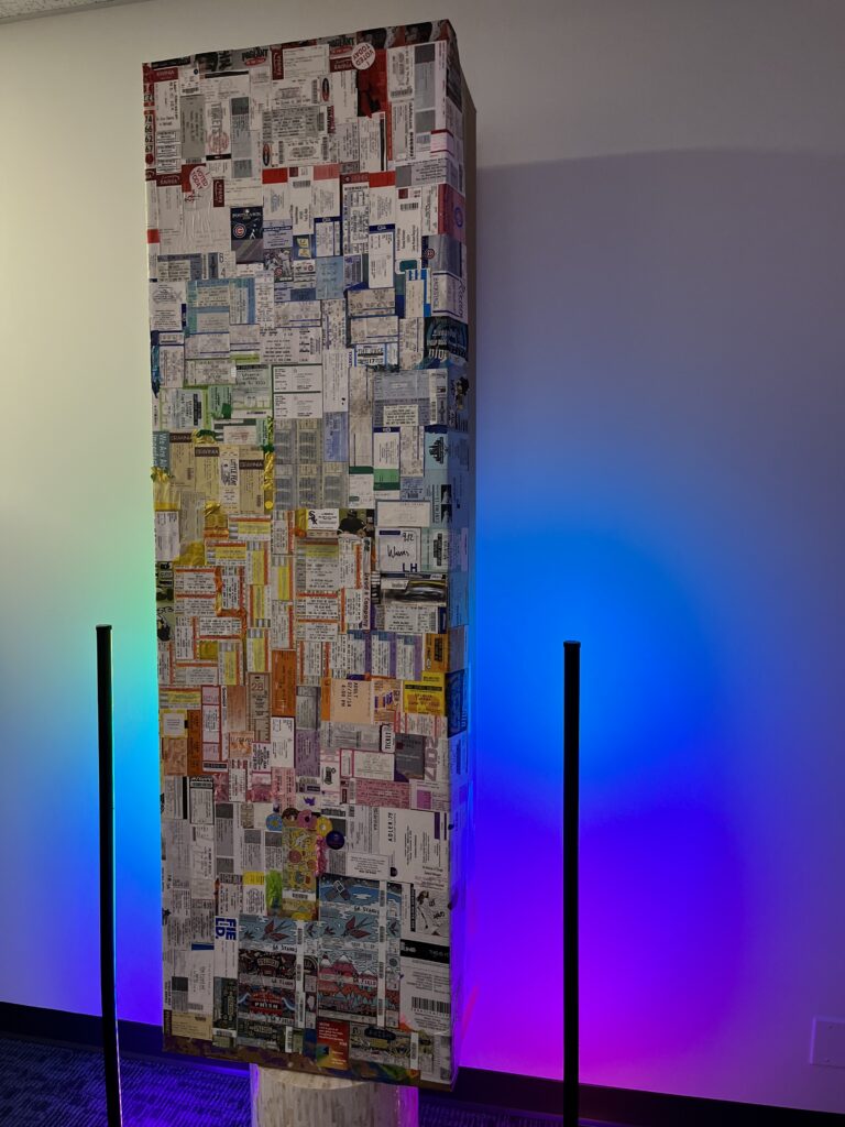 Valerie’s cremation container covered in ticket stubs.